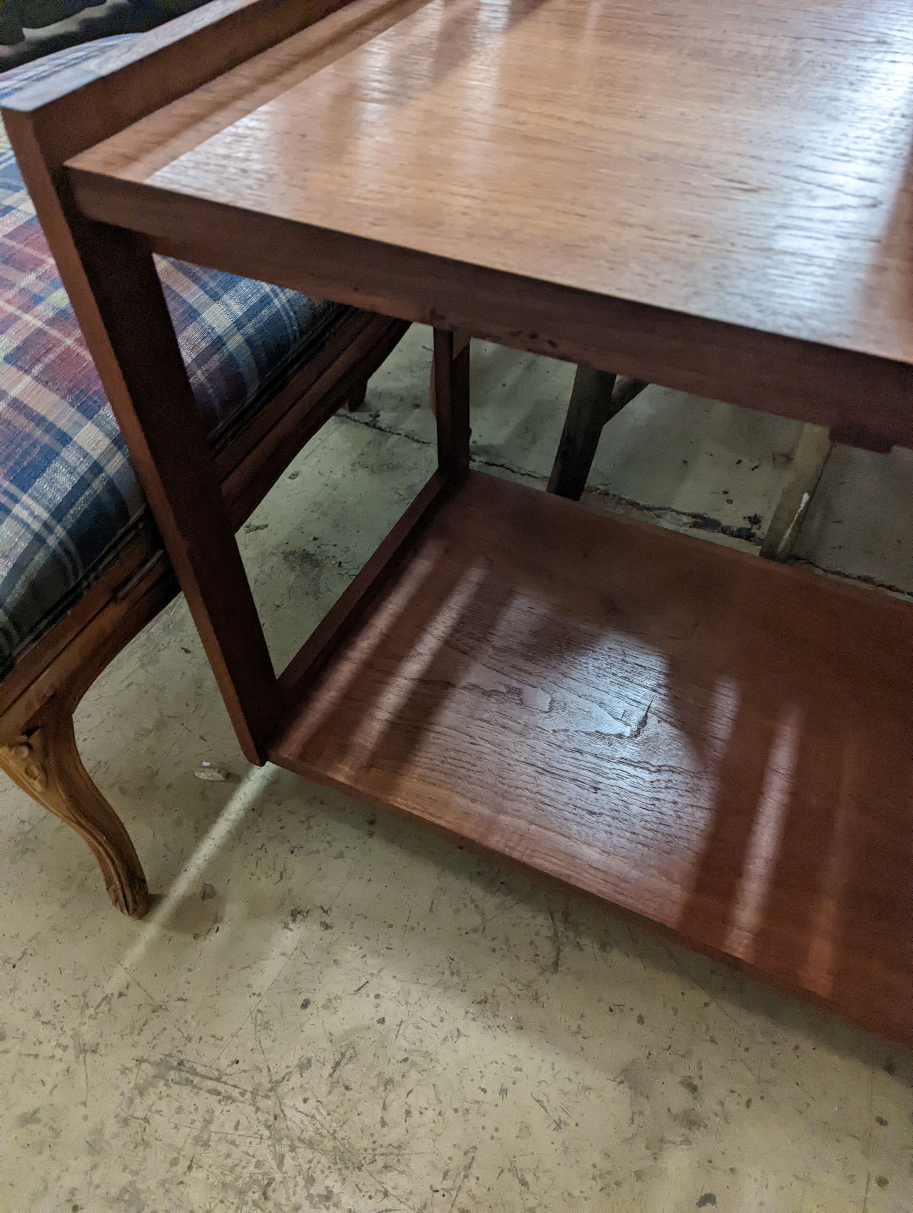 A 1960's rectangular teak two tier table fitted slides, width 80cm, depth 48cm, height 65cm